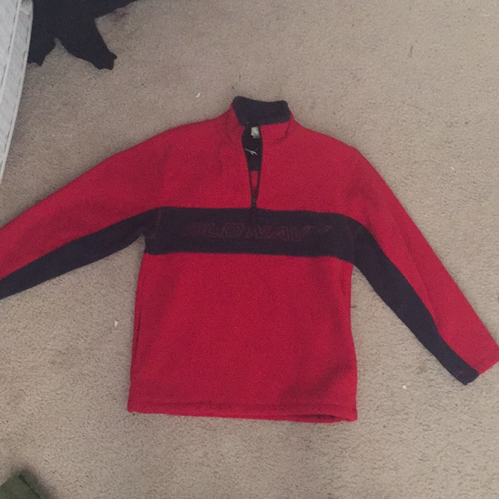 a red and black partial zip up sweatshirt. UNUSED